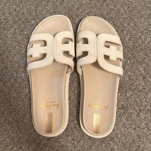 Sam Edelman slide on sandals with leather detail.